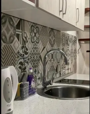 a kitchen counter with a sink and aaucet at Central13 App 2 in Tuzla