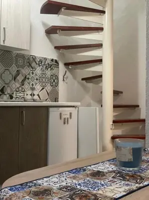 a kitchen with a counter with a table with a bowl on it at Central13 App 2 in Tuzla
