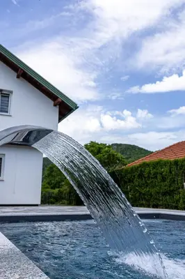 a water fountain in front of a house at Villa Asja in Bihać