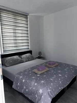 a bedroom with a bed with two pillows on it at Apartman Jasko 1 in Jajce