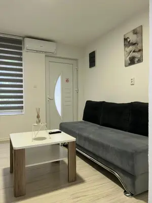 a living room with a couch and a table at Apartman Jasko 2 in Jajce