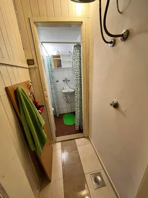 a small bathroom with a sink and a toilet at Stan Centar in Banja Luka