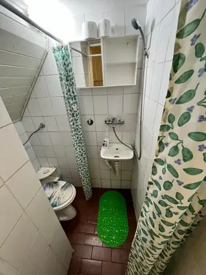 a small bathroom with a toilet and a sink at Stan Centar in Banja Luka