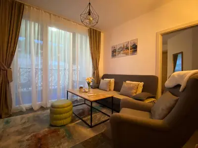 a living room with a couch and a table at Apartment Pahuljica in Travnik