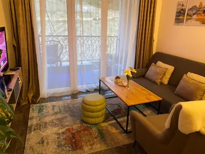 a living room with a couch and a table at Apartment Pahuljica in Travnik