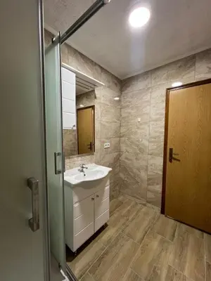 a bathroom with a sink and a mirror at Weekend house & apartments Dubrave in Visoko