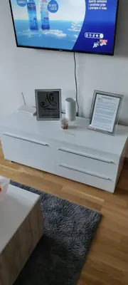 a white table with a laptop on top of it at Apartman gavric in Doboj