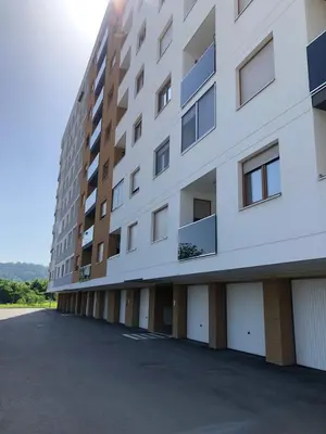 an empty parking lot in front of a building at Apartman gavric in Doboj