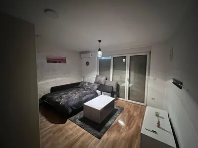 a living room with a couch and a table at Apartman gavric in Doboj