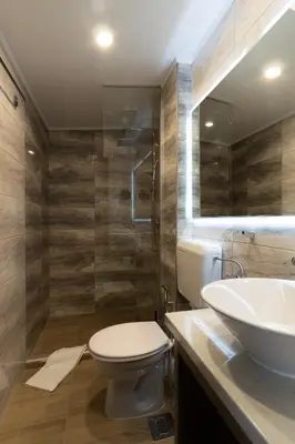 a bathroom with a toilet and a sink at Verdi Rooms in Visoko