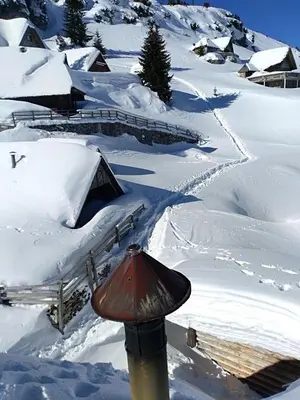a snow covered slope with a light on top of it at Prokoško jezero Zlatna koliba in Fojnica