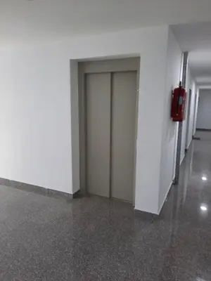 a hallway with two doors in a building at Apartman Bulevar in Doboj