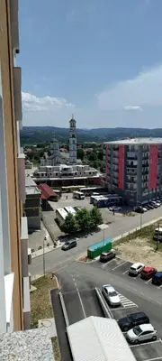 a view of a parking lot with cars on a street at Apartman Gavric in Doboj