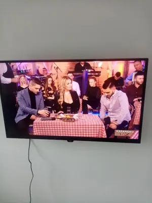 a flat screen tv hanging on a wall at Apartman Gavric in Doboj