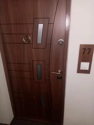 a wooden door with a number on it at Apartman Gavric in Doboj