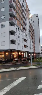 a building on a street with a street light at Apartman Gavric in Doboj