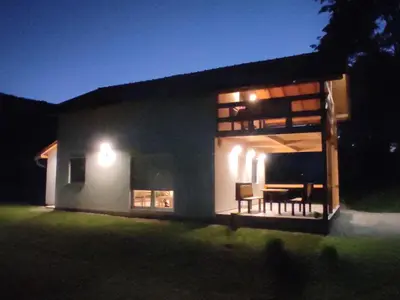 a house at night with lights on the side of it at Holiday home Una - H in Bosanska Krupa
