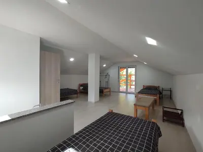 a bedroom with a bed and a living room at Holiday home Una - H in Bosanska Krupa