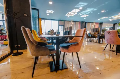 a dining room with a table and chairs at HOTEL LOBBY in Bihać