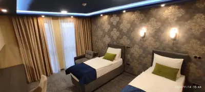 a room with two beds in a hotel room at HOTEL LOBBY in Bihać