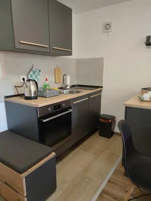 a small kitchen with a sink and a stove at Dream Home Studio Apartments in Tuzla