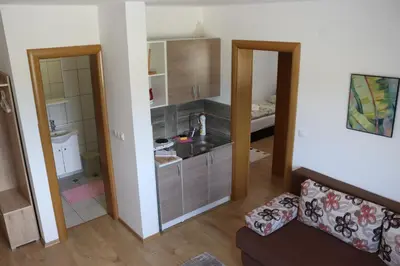 a small room with a kitchen and a living room at Vila Ana in Travnik