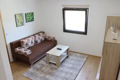 a living room with a couch and a table at Vila Ana in Travnik