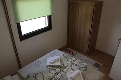 a small room with a bed and a window at Vila Ana in Travnik