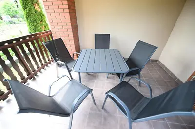 a blue table and chairs on a balcony at Sobe - Rooms Drvorez in Banja Luka