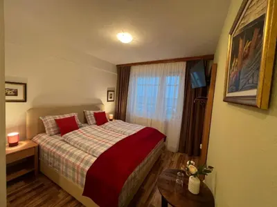 a hotel room with a bed and a window at Hotel Central Vlašić in Vlasic