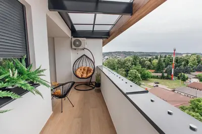 a balcony with a view of the city at Stan na dan - Chic Home Banja Luka in Banja Luka