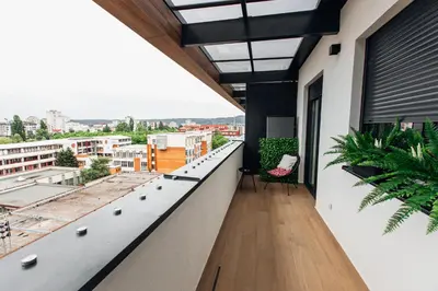a balcony with a view of a city at Stan na dan - Chic Home Banja Luka in Banja Luka