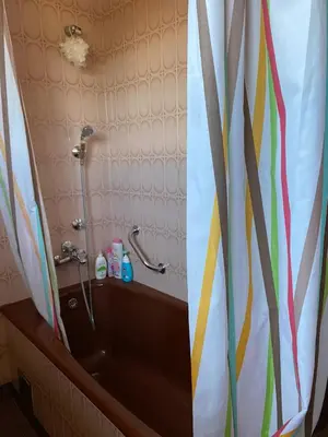 a shower in a bathroom with a shower curtain at Apartman Lavanda in Drvar