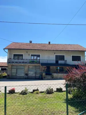 a large house with a fence in front of it at Apartman Lavanda in Drvar