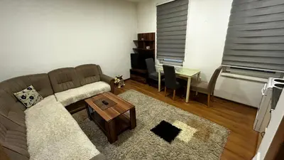 a living room with a couch and a table at Apartmani Venci Travnik in Travnik