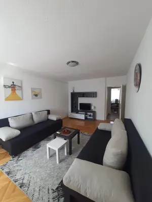 a living room with a couch and a table at Apartman Nataša BL in Banja Luka