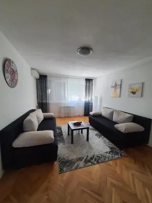 a living room with a couch and a table at Apartman Nataša BL in Banja Luka