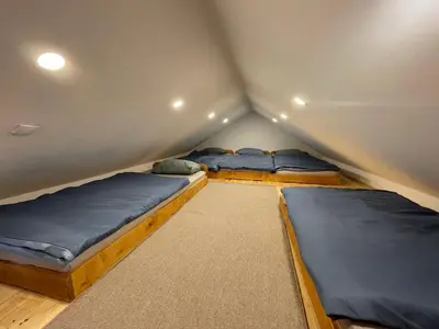 two beds in a small room at Mountain Heart House in Bosanski Petrovac