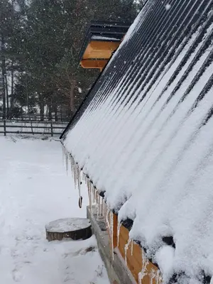 a snow covered roof of a building with snow on it at Planinska brvnara in Kupres