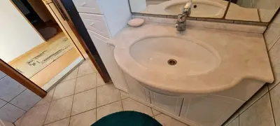 a bathroom with a toilet and a sink at Urban Home Visoko in Visoko