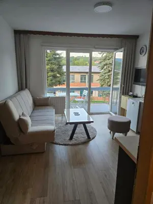 a living room with a couch and a coffee table at Urban Home Visoko in Visoko