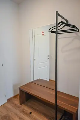 a room with a table and a white door at Hotel Premium in Jajce
