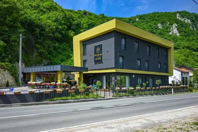 a building on the side of a road at Hotel Premium in Jajce