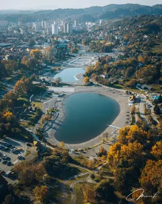 an aerial view of a river with a city in the background at Apartmani Roki in Tuzla