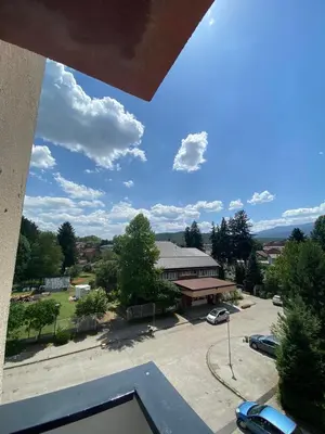 a view of a parking lot and a building at Apartman Citylux in Bihać