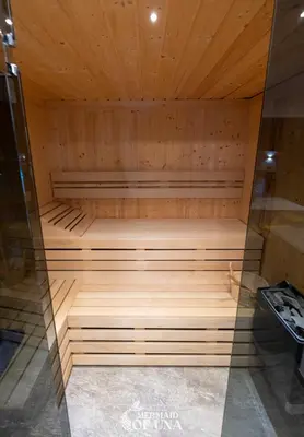 a sauna with wooden walls and a wooden ceiling at Villa Mermaid of Una in Bihać