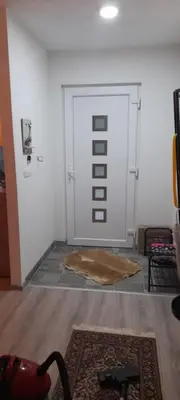a room with a white door with a rug in front at Ravne weekend house in Visoko