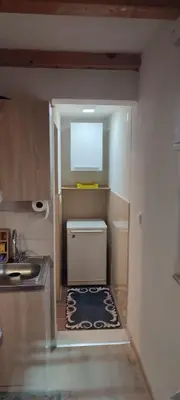 a small kitchen with a sink and a counter at Positive energy in Visoko
