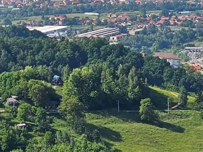 an aerial view of a green hill with trees at Positive energy in Visoko