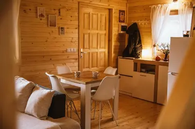 a kitchen and dining room with a table and chairs at Brvnaria in Slatina Varoš